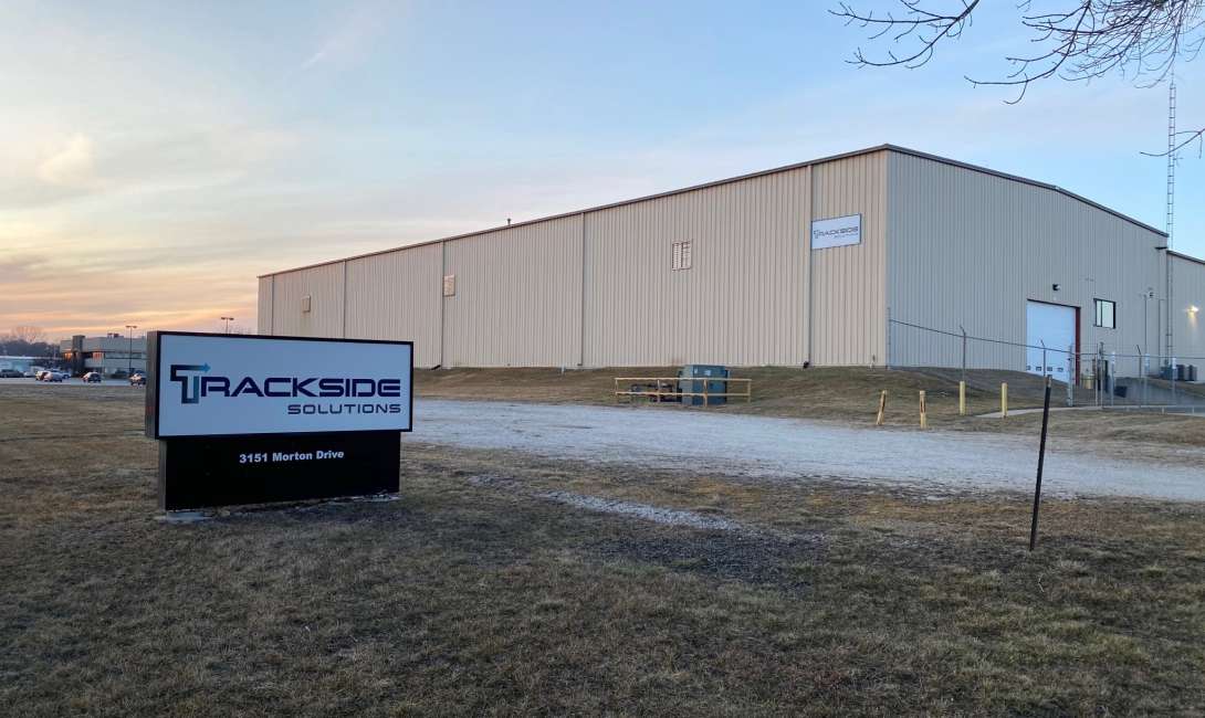 East Moline Shop showcasing an American Flag outdoors.