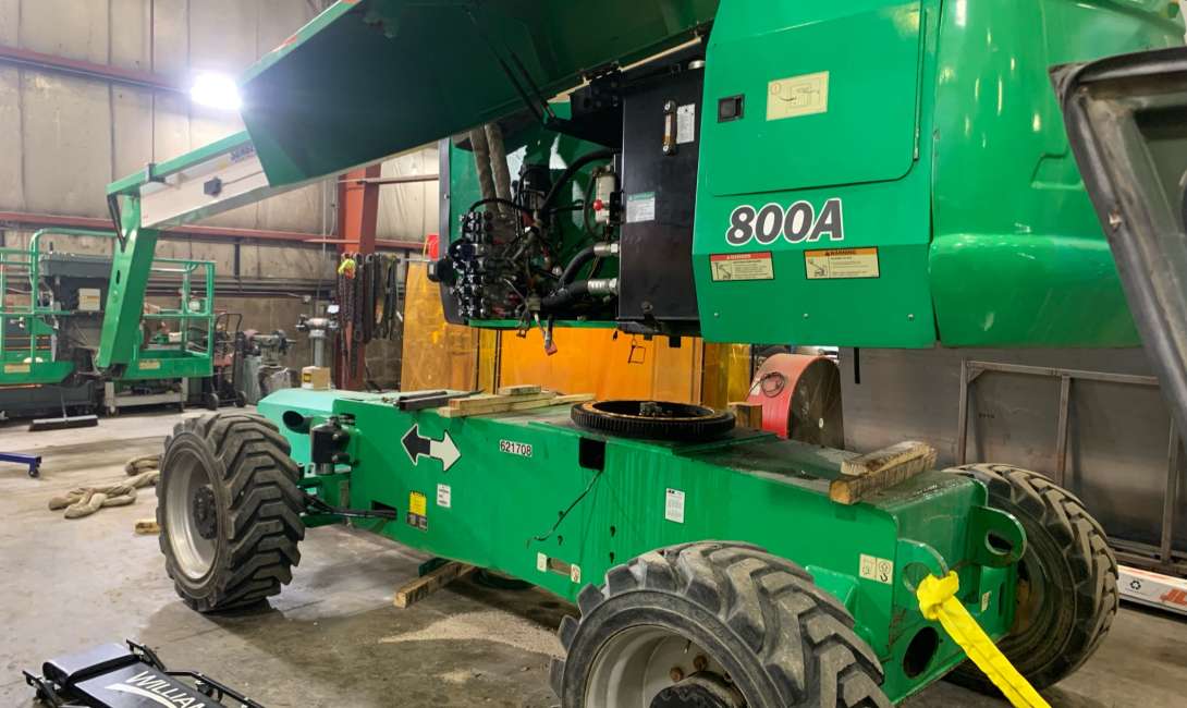 Heavy equipment repair being done to various types of equipment and vehicles.