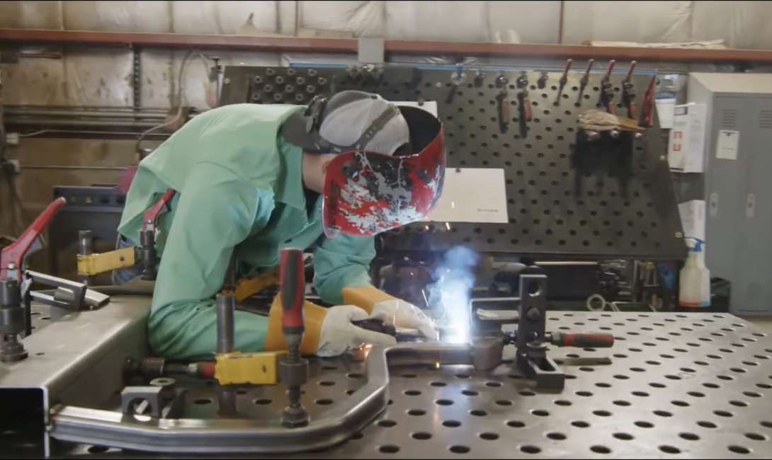 A Trackside employee welding.